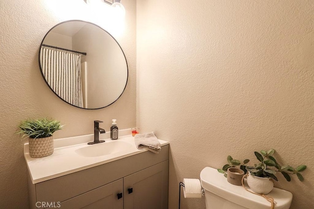 1330 Santa Fe Cir, Needles, CA 92363 - bathroom with toilet, vanity, and a textured wall