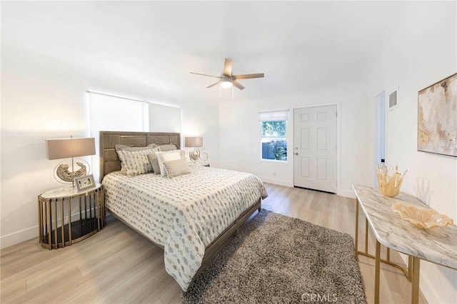 615 S Victoria Ave, Corona, CA 92879 - bedroom featuring wood finished floors, baseboards, and a ceiling fan