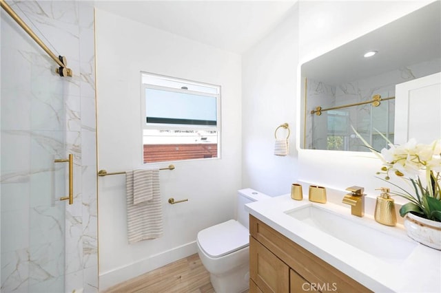 615 S Victoria Ave, Corona, CA 92879 - full bathroom featuring a marble finish shower, toilet, vanity, and wood finished floors