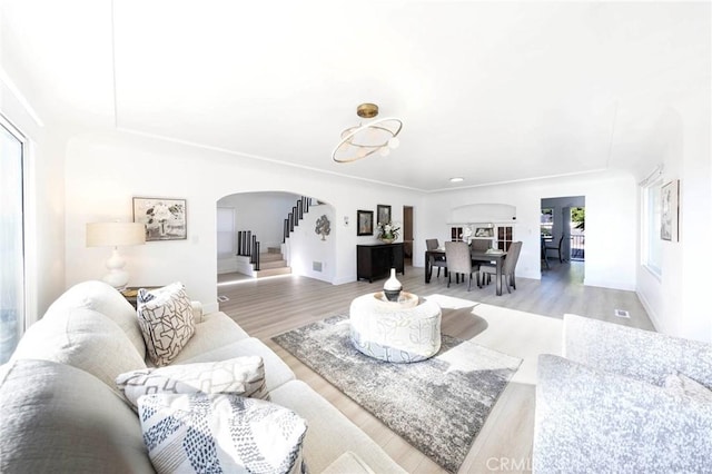 615 S Victoria Ave, Corona, CA 92879 - living area featuring arched walkways and wood finished floors