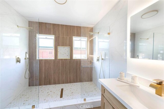 615 S Victoria Ave, Corona, CA 92879 - bathroom featuring a marble finish shower, vanity, and tile walls