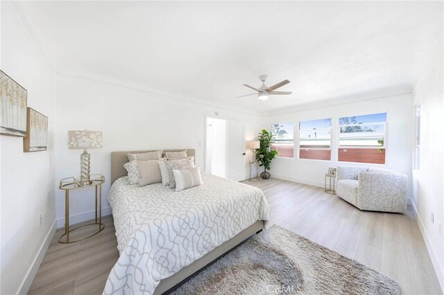 615 S Victoria Ave, Corona, CA 92879 - bedroom featuring light wood-style floors, baseboards, and ceiling fan