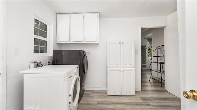 1373 W 5th St, San Bernardino, CA 92411 - laundry area featuring washer / clothes dryer, cabinet space, and light wood finished floors