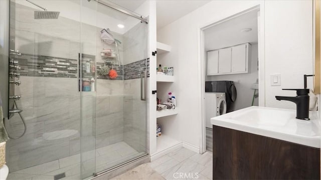 1373 W 5th St, San Bernardino, CA 92411 - full bathroom featuring vanity, a stall shower, and independent washer and dryer