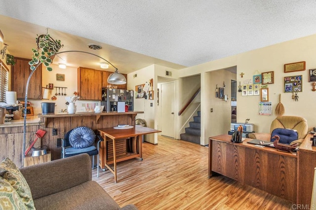 150 Richeth Rd, San Diego, CA 92114 - living room with a textured ceiling, stairway, and light wood-style flooring
