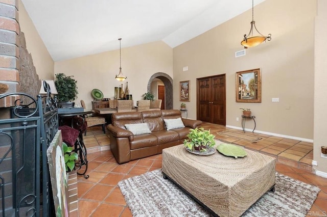 1663 Linda Sue Ln, Encinitas, CA 92024 - living room featuring arched walkways, light tile patterned floors, and high vaulted ceiling
