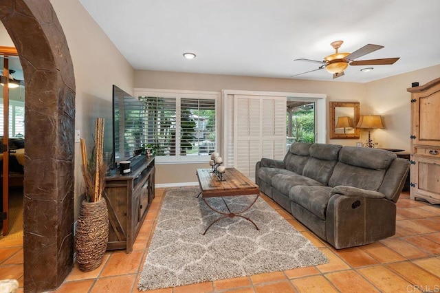 1663 Linda Sue Ln, Encinitas, CA 92024 - living area with ceiling fan, arched walkways, and light tile patterned floors