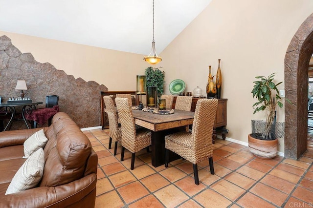 1663 Linda Sue Ln, Encinitas, CA 92024 - dining room featuring arched walkways, light tile patterned floors, and high vaulted ceiling