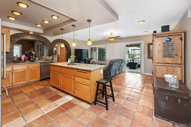 1663 Linda Sue Ln, Encinitas, CA 92024 - kitchen featuring stainless steel dishwasher, arched walkways, open floor plan, a center island, and ceiling fan