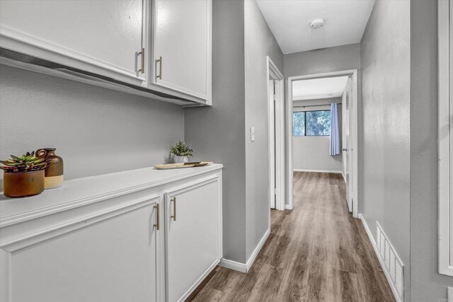 6363 Rancho Mission Rd Unit 4, San Diego, CA 92108 - hallway with wood finished floors and baseboards