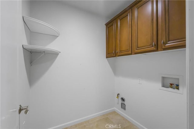 23795 Los Pinos Ct, Corona, CA 92883 - laundry area featuring hookup for a washing machine, cabinet space, baseboards, hookup for a gas dryer, and hookup for an electric dryer