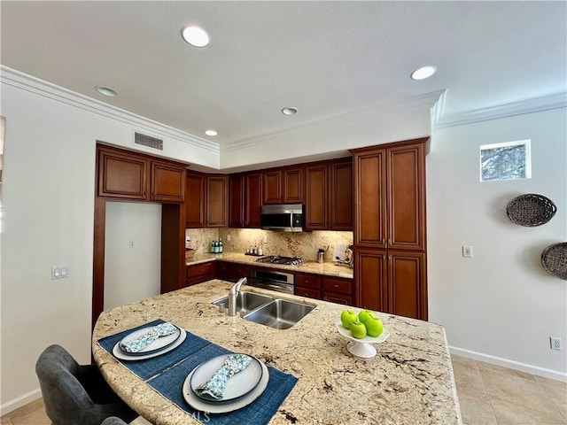 23795 Los Pinos Ct, Corona, CA 92883 - kitchen with stainless steel appliances, a sink, tasteful backsplash, crown molding, and baseboards