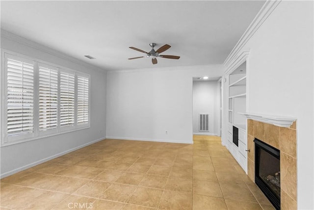 23795 Los Pinos Ct, Corona, CA 92883 - unfurnished living room featuring a ceiling fan, built in shelves, a tiled fireplace, ornamental molding, and baseboards
