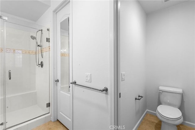 23795 Los Pinos Ct, Corona, CA 92883 - full bathroom featuring a stall shower, toilet, tile patterned floors, and baseboards