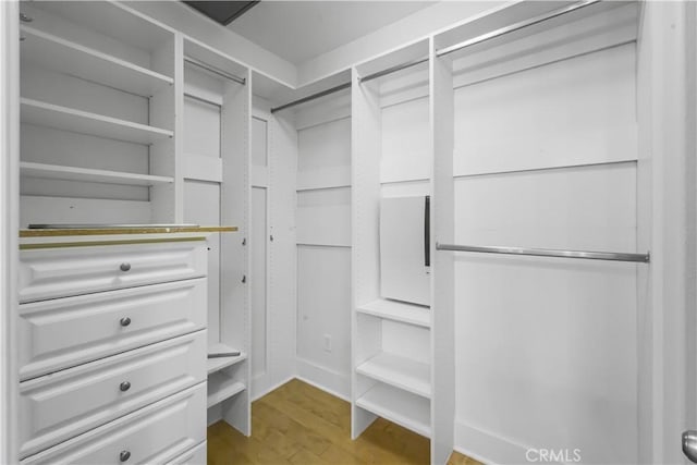23795 Los Pinos Ct, Corona, CA 92883 - walk in closet featuring wood finished floors