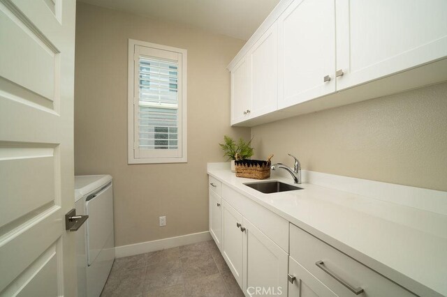 109 Pitch, Irvine, CA 92618 - washroom with washing machine and clothes dryer and cabinet space