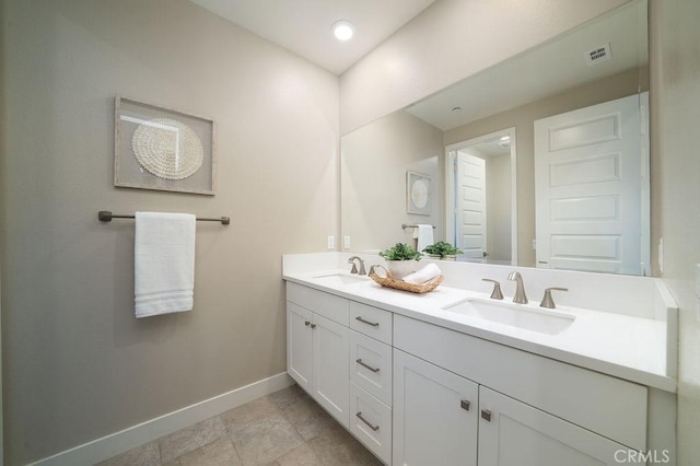 109 Pitch, Irvine, CA 92618 - bathroom featuring baseboards and double vanity