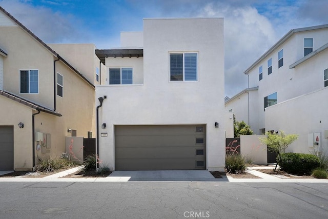 109 Pitch, Irvine, CA 92618 - view of front facade featuring a garage and stucco siding