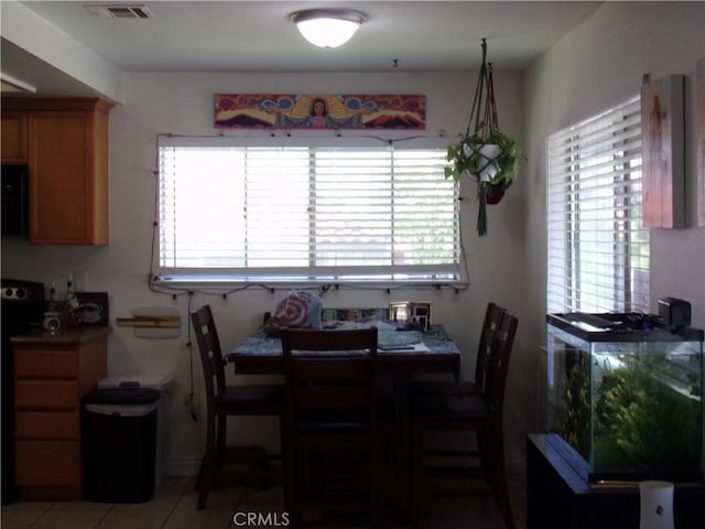 1598 Border Ave Unit H, Corona, CA 92882 - dining space featuring light tile patterned flooring