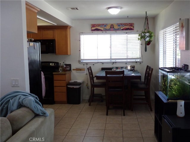 1598 Border Ave Unit H, Corona, CA 92882 - dining space featuring light tile patterned flooring