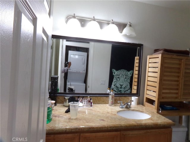 1598 Border Ave Unit H, Corona, CA 92882 - bathroom with stacked washer / drying machine and vanity