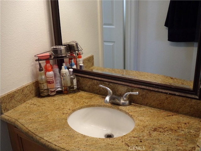 1598 Border Ave Unit H, Corona, CA 92882 - bathroom view of vanity and a textured wall