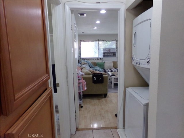1598 Border Ave Unit H, Corona, CA 92882 - laundry room with estacked washer and dryer, recessed lighting, and light tile patterned floors