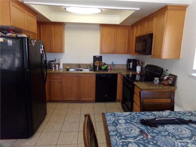1598 Border Ave Unit H, Corona, CA 92882 - kitchen with black appliances, a raised ceiling, ornamental molding, brown cabinetry, and light tile patterned floors
