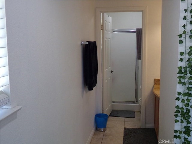 1598 Border Ave Unit H, Corona, CA 92882 - corridor with baseboards and light tile patterned floors