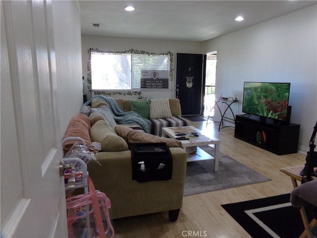 1598 Border Ave Unit H, Corona, CA 92882 - living room featuring light wood-type flooring and recessed lighting