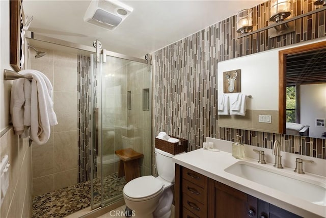 1370 Calgary Dr, Lake Arrowhead, CA 92352 - full bath featuring tile walls, vanity, toilet, a stall shower, and backsplash