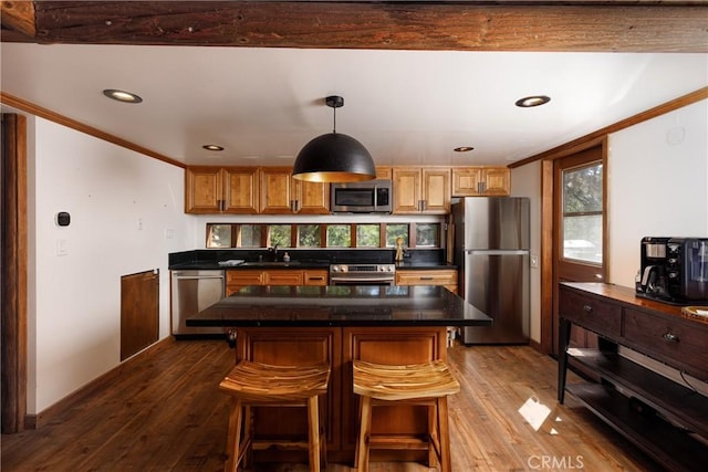 1370 Calgary Dr, Lake Arrowhead, CA 92352 - kitchen with stainless steel appliances, a sink, ornamental molding, dark wood-style floors, and dark countertops