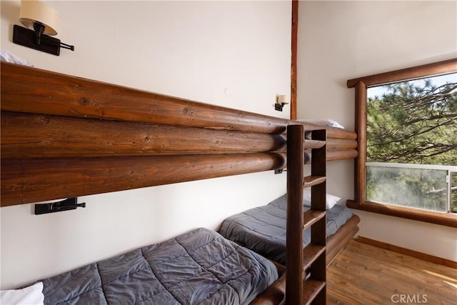 1370 Calgary Dr, Lake Arrowhead, CA 92352 - bedroom with wood finished floors and multiple windows
