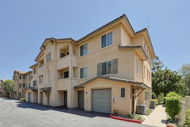 3171 Dehesa Rd Unit 3, El Cajon, CA 92019 - view of building exterior with central AC and a garage