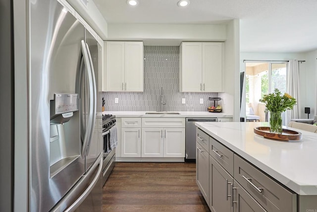 3171 Dehesa Rd Unit 3, El Cajon, CA 92019 - kitchen featuring appliances with stainless steel finishes, a sink, light countertops, dark wood finished floors, and white cabinetry