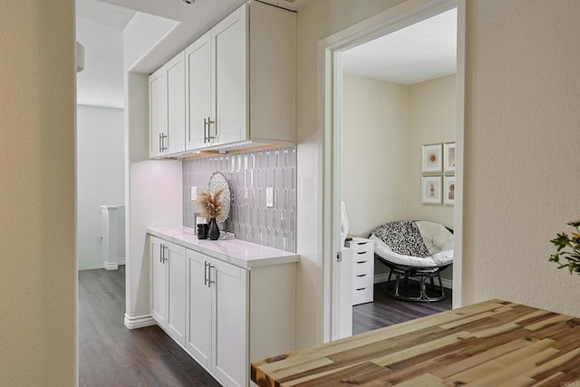 3171 Dehesa Rd Unit 3, El Cajon, CA 92019 - kitchen with dark wood-type flooring, white cabinets, and a textured wall