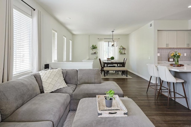 3171 Dehesa Rd Unit 3, El Cajon, CA 92019 - living room featuring dark wood-style flooring, a chandelier, and baseboards