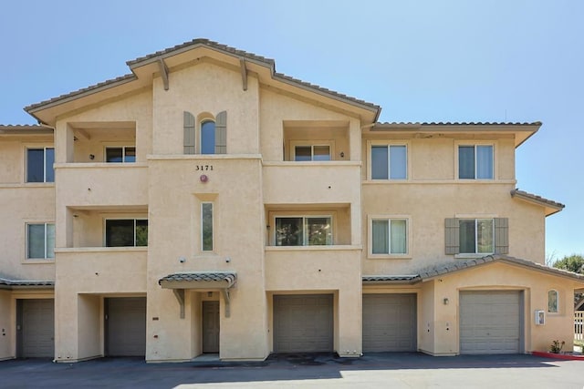 3171 Dehesa Rd Unit 3, El Cajon, CA 92019 - view of building exterior with a garage
