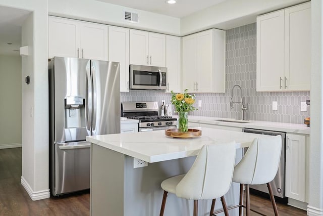 3171 Dehesa Rd Unit 3, El Cajon, CA 92019 - kitchen featuring appliances with stainless steel finishes, a sink, dark wood finished floors, backsplash, and recessed lighting