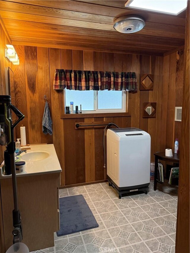 98011 Maine Rd, Kennedy Meadows, CA 93527 - bathroom with wood ceiling, vanity, and wood walls