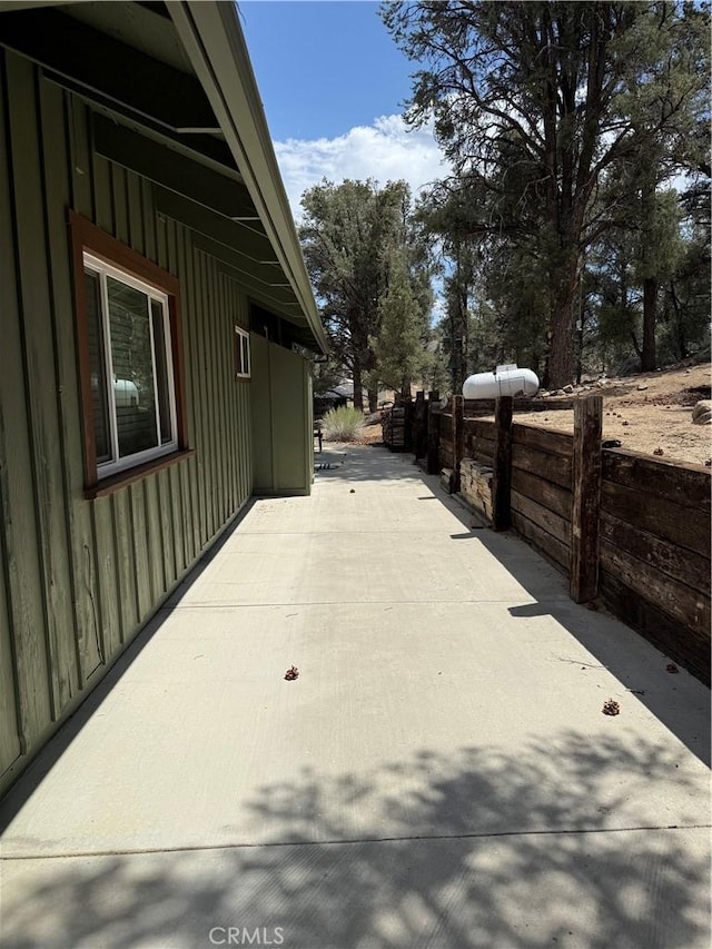 98011 Maine Rd, Kennedy Meadows, CA 93527 - view of side of property featuring board and batten siding and a patio area