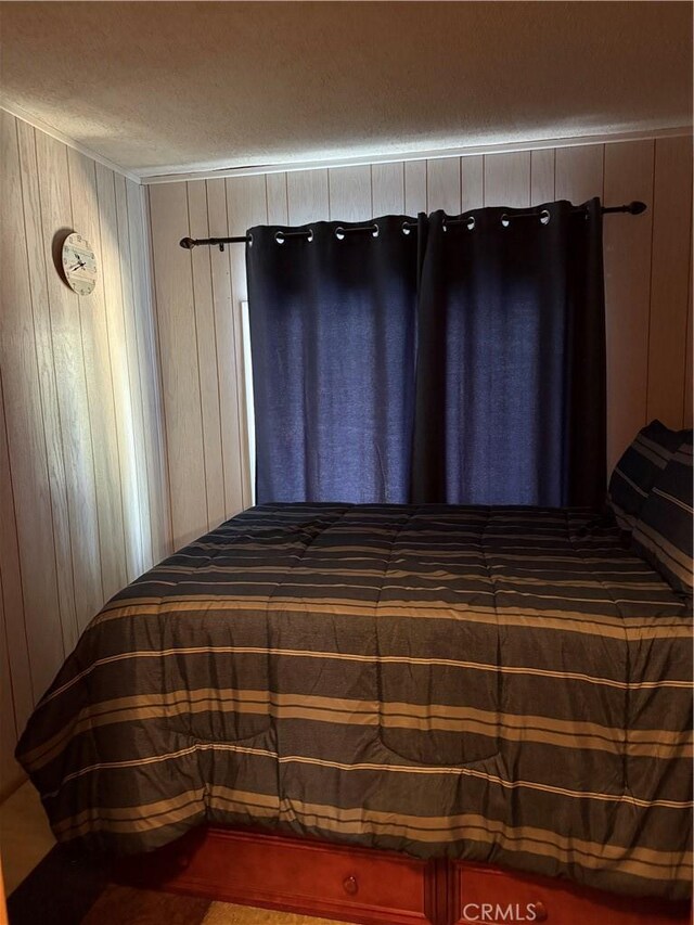 98011 Maine Rd, Kennedy Meadows, CA 93527 - bedroom featuring a textured ceiling and wooden walls