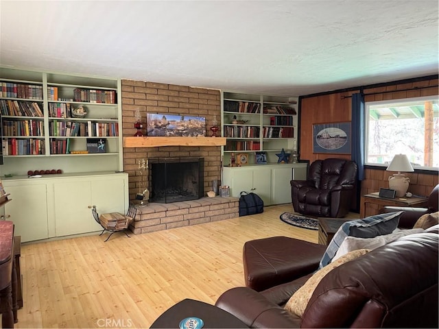 98011 Maine Rd, Kennedy Meadows, CA 93527 - living area with wood finished floors, a fireplace, and built in shelves