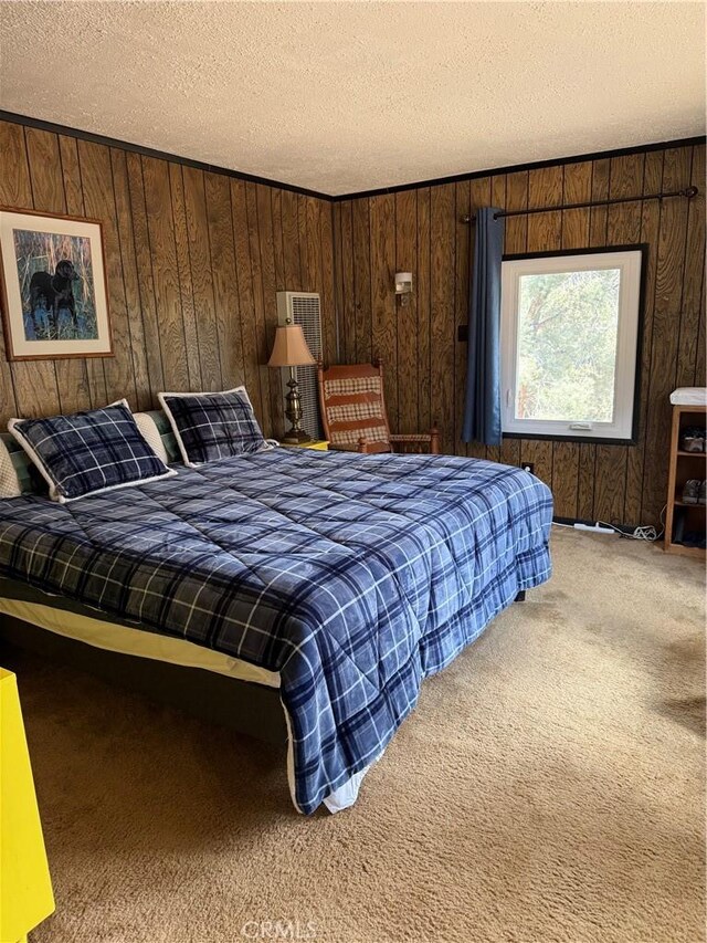98011 Maine Rd, Kennedy Meadows, CA 93527 - carpeted bedroom featuring a textured ceiling and wood walls