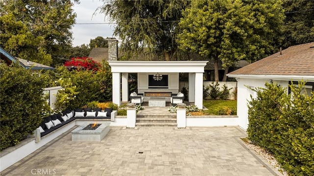 1281 E Orange Grove Blvd, Pasadena, CA 91104 - view of patio / terrace featuring an outdoor fire pit and exterior fireplace