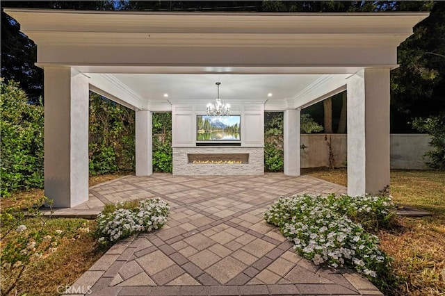 1281 E Orange Grove Blvd, Pasadena, CA 91104 - view of patio / terrace with a lit fireplace
