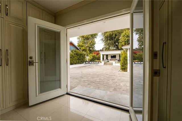 1281 E Orange Grove Blvd, Pasadena, CA 91104 - doorway to outside featuring crown molding and light tile patterned floors