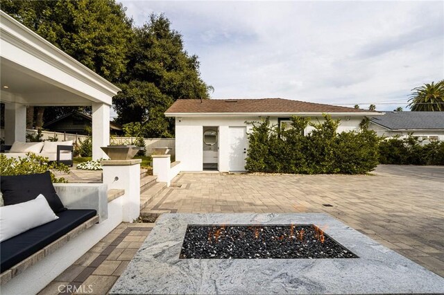 1281 E Orange Grove Blvd, Pasadena, CA 91104 - view of patio featuring an outdoor living space with a fire pit