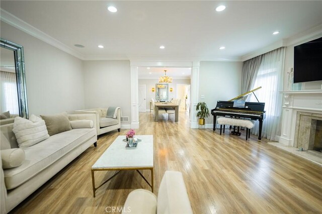 1281 E Orange Grove Blvd, Pasadena, CA 91104 - living area featuring recessed lighting, wood finished floors, ornamental molding, a high end fireplace, and baseboards