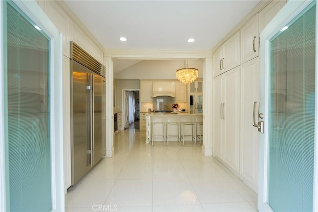 1281 E Orange Grove Blvd, Pasadena, CA 91104 - hallway featuring a chandelier, light tile patterned floors, and recessed lighting